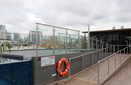 Holiday Inn Express Singapore Clarke Quay rooftop pool. Gay-friendly hotel with SG Clean Certified. City skyline view.