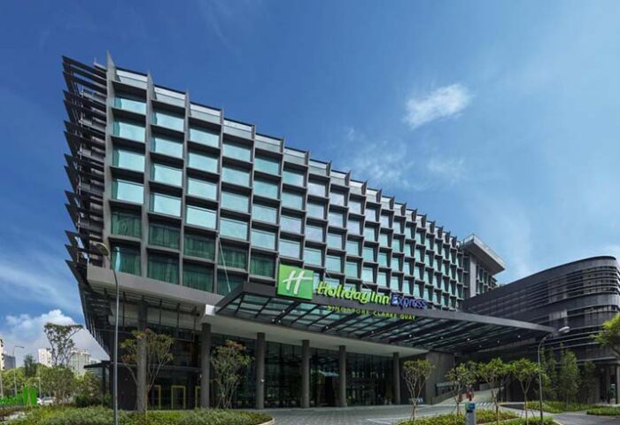 Holiday Inn Express Singapore Clarke Quay, a gay-friendly hotel. Modern building exterior with a blue sky. SG Clean Certified hotel.