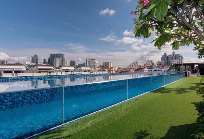 Holiday Inn Express Singapore Clarke Quay gay-friendly hotel rooftop pool. SG Clean Certified. Skyline view from the pool. Great for gay travel.