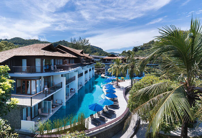 Holiday Inn Resort Krabi Ao Nang Beach: Gay-friendly hotel with pool access rooms, blue umbrellas, palm trees, and lush tropical scenery.