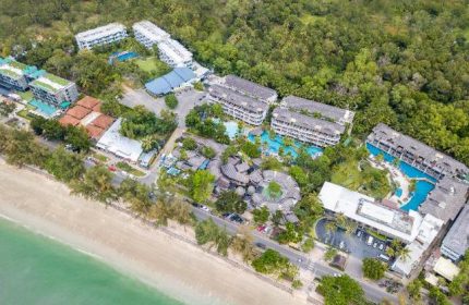 Holiday Inn Resort Krabi Ao Nang Beach aerial view. Gay-friendly hotel with pools, beach access, and lush tropical surroundings.