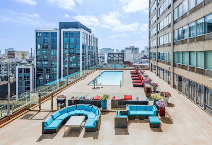 Holiday Inn San Francisco Golden Gateway gay-friendly hotel rooftop pool. Lounge seating and city views. Perfect for gay travel.