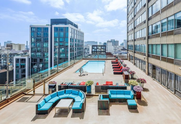 Holiday Inn San Francisco Golden Gateway gay-friendly hotel rooftop pool. Lounge seating and city views. Perfect for gay travel.