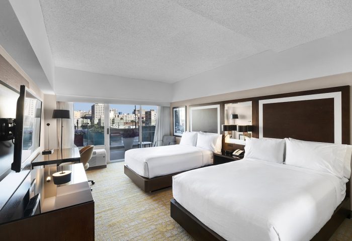 Holiday Inn San Francisco Golden Gateway room. Gay-friendly hotel with two beds, desk, TV, and balcony overlooking the city.
