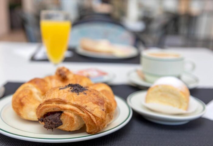 Gay-friendly Hotel Hostal Residencia Molins Park: Breakfast with croissants, orange juice, coffee, and pastry. Travel advice for gay men.