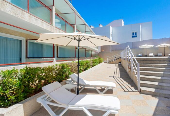 Hostal Residencia Molins Park gay-friendly hotel. Sun loungers and parasols for guests' relaxation. Ideal lodging for gay men travelers.