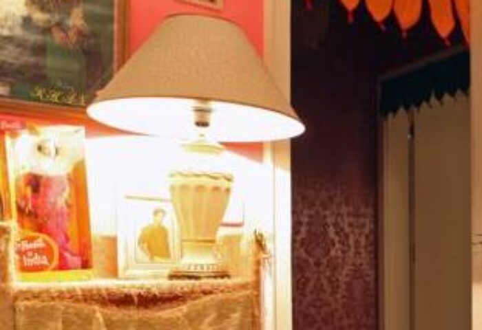 Interior detail at Hostel die Wohngemeinschaft, a gay-friendly hotel. Lamp, decorations, and a cozy atmosphere. Gay travel advice.