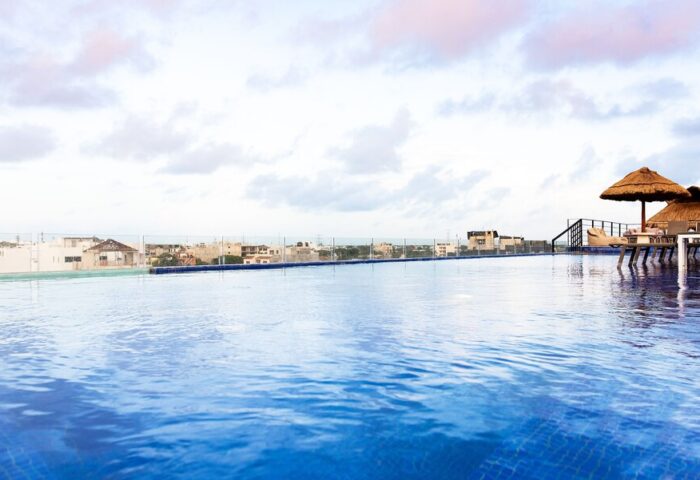 Hotel 52's rooftop pool, a gay-friendly hotel. Relaxing cabanas overlook the city. Perfect for gay travel and a welcoming stay.