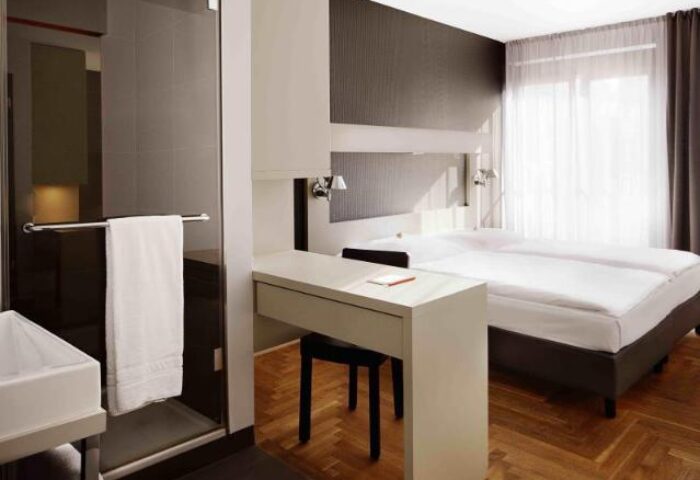 Hotel AMANO's room: a modern, pet-friendly & gay-friendly hotel. Double bed, desk, and shower. Great for gay men travel.