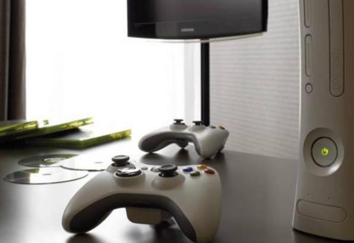 Hotel AMANO pet-friendly room: Xbox console, controllers, games, and TV. Gay-friendly hotel offers in-room entertainment for a comfortable stay.