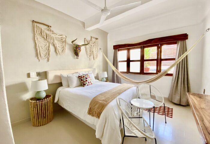 Hotel Amaca Puerto Vallarta Adults Only room. Hammock, bed, and macrame art. Gay-friendly hotel for gay men's travel in Puerto Vallarta.