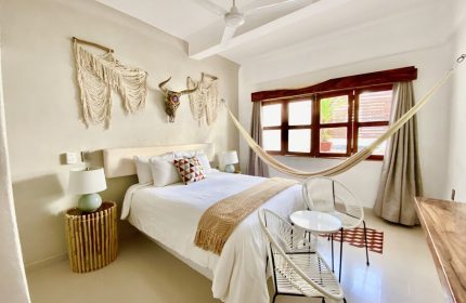 Hotel Amaca Puerto Vallarta Adults Only room. Hammock, bed, and macrame art. Gay-friendly hotel for gay men's travel in Puerto Vallarta.