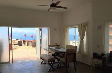 Hotel Amaca Puerto Vallarta Adults Only suite. Dining area with ocean view. Gay-friendly hotel with outdoor lounge.