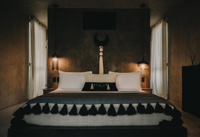 Hotel Bardo Adults Only room. Gay-friendly hotel bedroom with king bed, dark walls, minimal decor. Ideal for gay travel, romantic getaway.