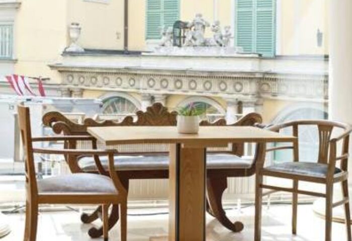 Hotel Beethoven Wien interior. Table and chairs in a bright room. Gay-friendly hotel in Vienna, Austria. Travel advice for gay men.