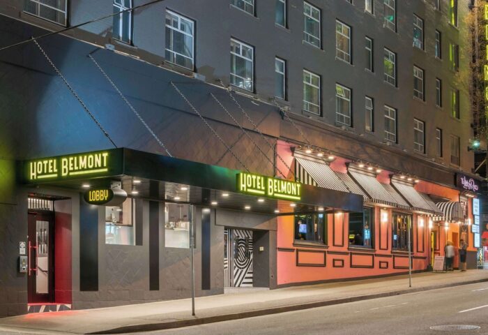 Hotel Belmont Vancouver Mgallery's exterior at night. Gay-friendly hotel with neon signs. Great location for gay travelers.