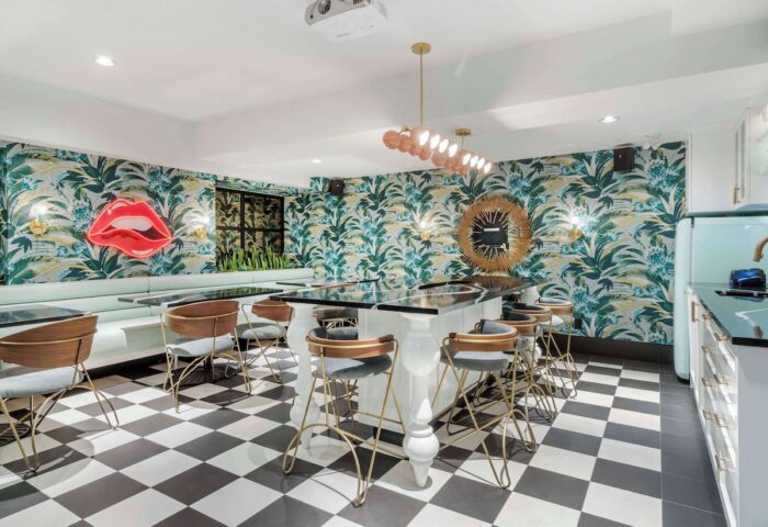 Hotel Belmont Vancouver Mgallery's stylish bar. Gay-friendly hotel with unique decor, tropical wallpaper, and a black-and-white checkered floor.