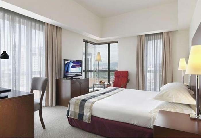 Hotel Capitol Kuala Lumpur room. Gay-friendly hotel with bed, desk, TV, and city view. Modern design, comfortable for gay travelers.