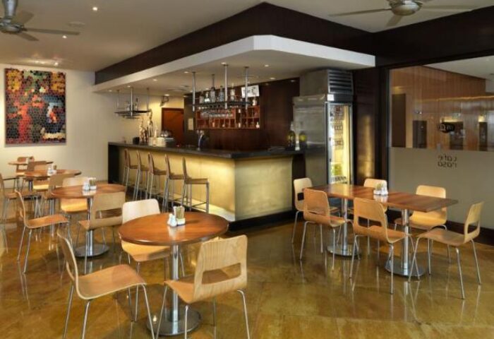Hotel Capitol Kuala Lumpur's stylish bar area. Gay-friendly hotel with seating, bar stools, and modern decor. Perfect for gay travelers.