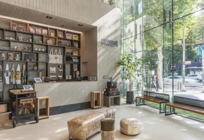 Hotel Cappuccino Seoul's lobby. This gay-friendly hotel features modern design, a front desk, and floor-to-ceiling windows. Seoul travel.