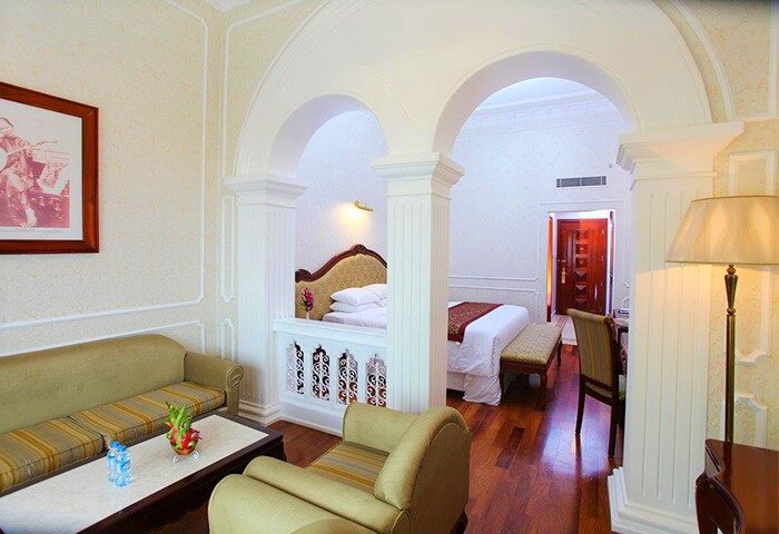 Hotel Continental Saigon room. Gay-friendly hotel with classic design, arches, and hardwood floors. A luxury suite for gay travelers.