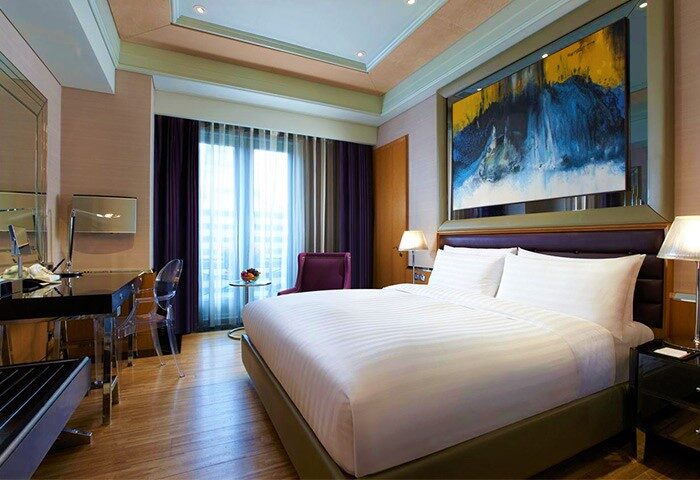 Hotel Eclat Taipei gay-friendly hotel room. Interior view of a luxurious bedroom with a king-size bed and modern decor.