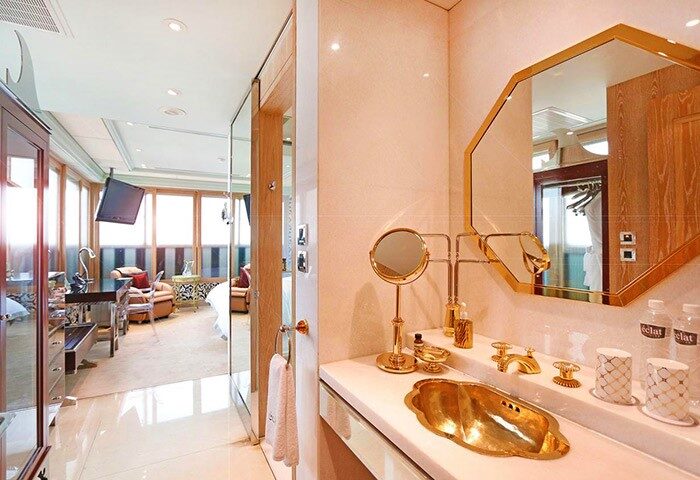 Hotel Eclat Taipei's gay-friendly bathroom. Gold fixtures, octagonal mirror, and luxurious design. A great choice for gay travelers.