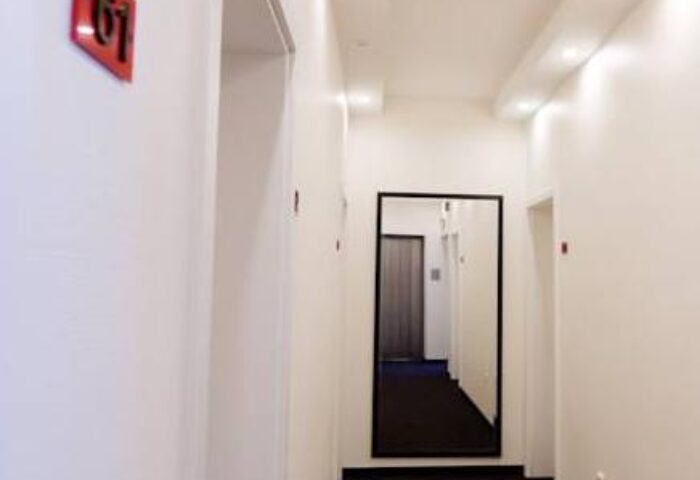 Hotel Esplanade Köln hallway. The gay-friendly hotel features modern design and clean lines. Room 61 is visible. A great choice for gay travel.