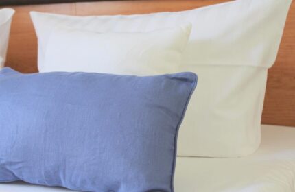 Hotel Expo Frankfurt City Centre detail: A blue pillow sits in front of white pillows on a bed in this gay-friendly hotel.