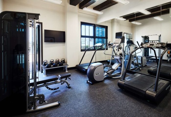 Hotel Figueroa's gym, a gay-friendly hotel in Los Angeles. Cardio machines, weights, and a multi-gym provide options for a full workout.