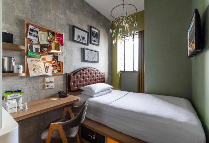Hotel G Singapore gay-friendly hotel room. Single bed, desk, and decor. Modern design, comfortable space. Ideal for gay travelers in Singapore.