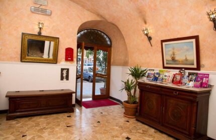 Hotel Giubileo's gay-friendly lobby. View of the entrance, furniture, and decor. A welcoming space for gay travelers in Rome, Italy.