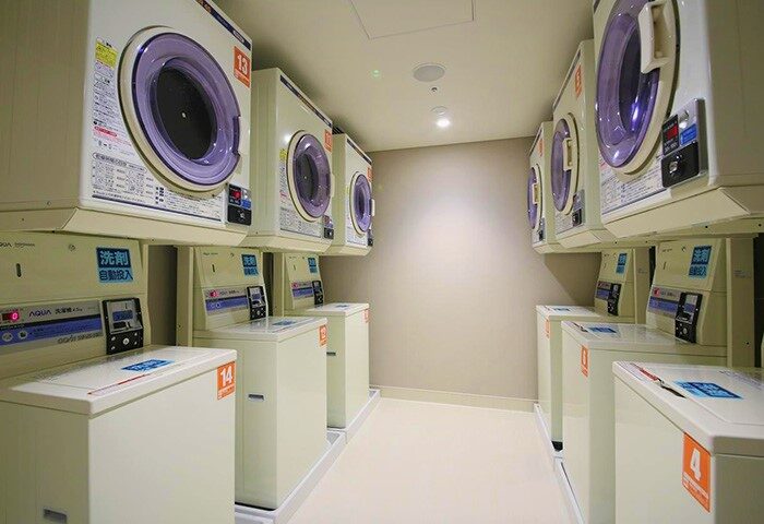 Hotel Gracery Shinjuku's laundry room. Coin-operated washing machines, convenient for gay travelers. A practical amenity at this gay-friendly hotel.