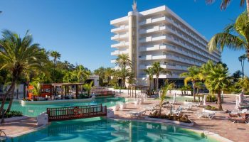 Hotel Gran Canaria Princess Adults Only, a gay-friendly hotel. Pool, palm trees, and modern architecture.