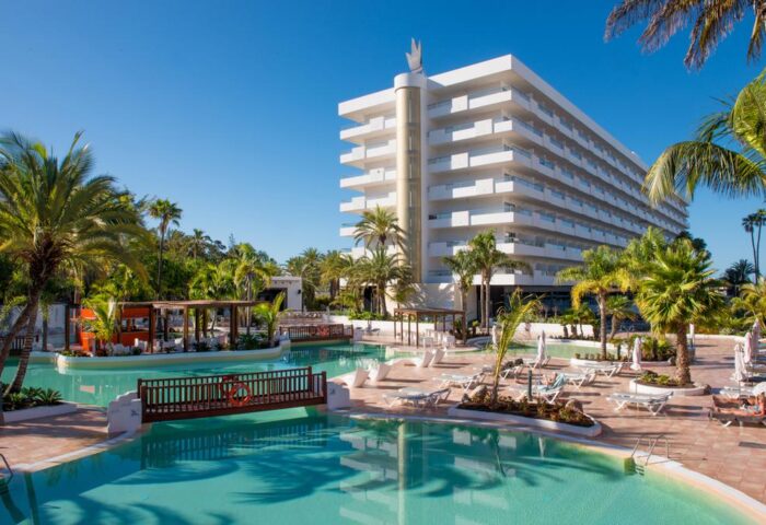 Hotel Gran Canaria Princess Adults Only, a gay-friendly hotel. Pool, palm trees, and modern architecture.