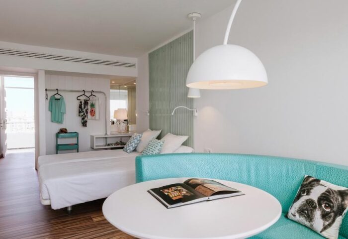 Adults-Only Gran Canaria Princess Hotel room. Modern design, turquoise accents, dog pillow. Gay-friendly hotel in Playa del Ingles.