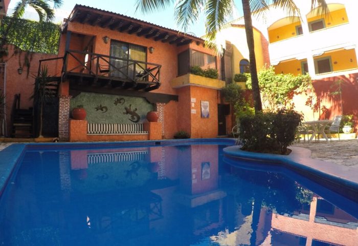 Hotel Hacienda Maria Bonita, a gay-friendly hotel. View of the pool and the hacienda-style architecture. A great place for gay travelers.