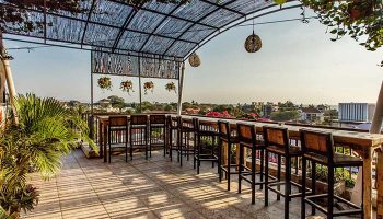 Rooftop bar at Gay-Friendly Hotel Horison Seminyak Bali. Outdoor seating with a view. Perfect for gay travelers in Bali.