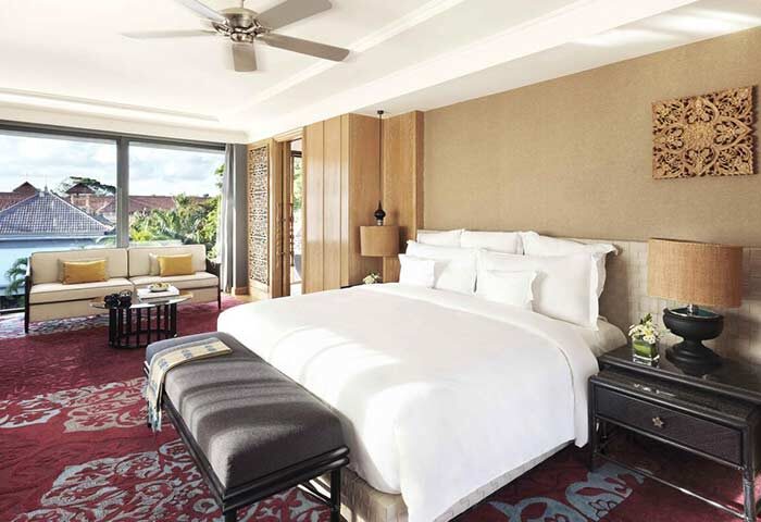Hotel Indigo Bali Seminyak Beach gay-friendly room. Luxurious bedding, seating area, and stylish decor. A great place for gay travelers.