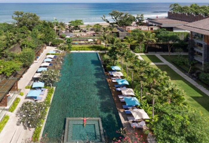 Hotel Indigo Bali Seminyak Beach pool view. Gay-friendly hotel with ocean view, lush greenery, and relaxing atmosphere for gay travelers.