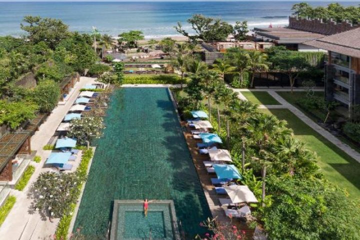 Hotel Indigo Bali Seminyak Beach pool view. Gay-friendly hotel with ocean view, lush greenery, and relaxing atmosphere for gay travelers.