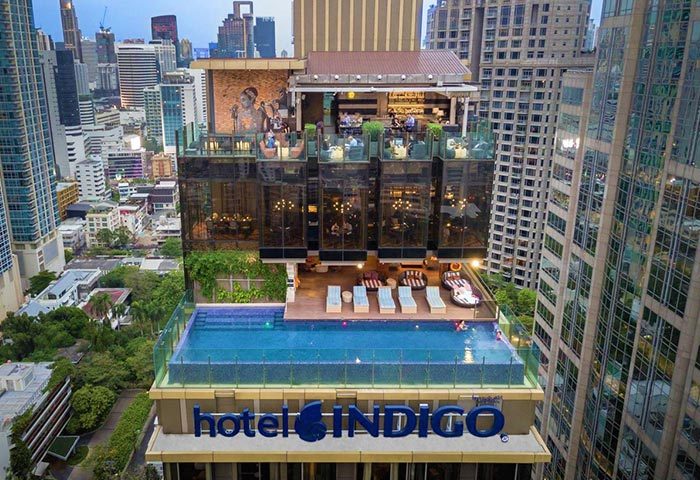 Hotel Indigo Bangkok Wireless Road rooftop pool and bar. Gay-friendly hotel with city views. Perfect for gay travel in Bangkok.