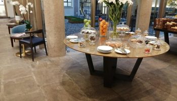 Hotel Indigo Milan Corso Monforte: Breakfast buffet with cakes, fruit, and pastries. Gay-friendly hotel with stylish interior design.