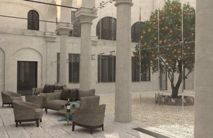 Hotel Indigo Milan Corso Monforte courtyard with seating. Gay-friendly hotel with modern design, ideal for gay men travel in Milan, Italy.