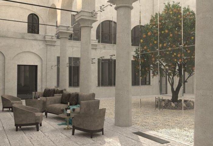 Hotel Indigo Milan Corso Monforte courtyard with seating. Gay-friendly hotel with modern design, ideal for gay men travel in Milan, Italy.