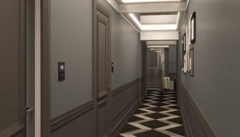 Hotel Indigo Milan Corso Monforte hallway. Gay-friendly hotel with a stylish interior. Modern design with a black and white patterned carpet.