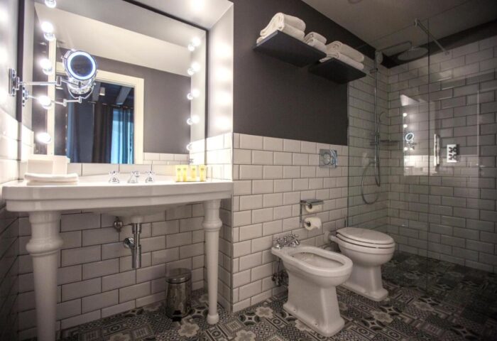 Hotel Indigo Milan Corso Monforte gay-friendly hotel bathroom. Classic design with modern fixtures, walk-in shower, and stylish tile work.