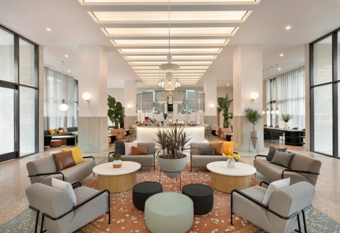Hotel Indigo Williamsburg, Brooklyn lobby. Gay-friendly hotel with modern design, seating areas, and a bar. Interior of the hotel.