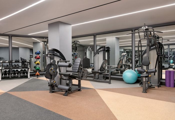 Hotel Indigo Williamsburg Brooklyn gym. Fitness center with weights, machines, yoga mats, and mirrored walls. Gay-friendly hotel.