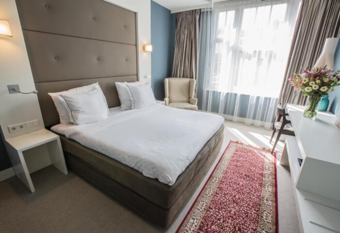 Hotel JL No76 gay-friendly hotel room. Modern design with a large bed, stylish furniture, and a cozy atmosphere. Perfect for gay travel.